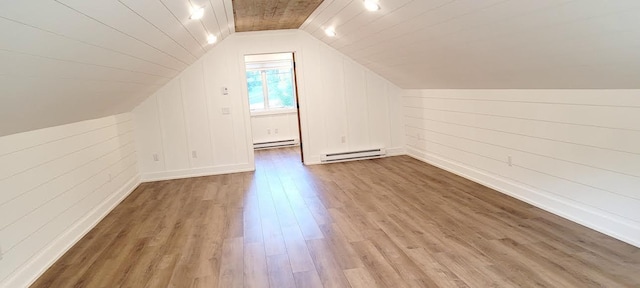 9029 Crown Hill Ct, Brainerd, MN 56401 - bonus room featuring a baseboard heating unit, lofted ceiling, and wood finished floors