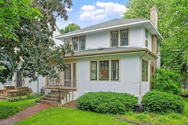 4300 Beard Ave S, Minneapolis, MN 55410 - view of front of property with a chimney, stucco siding, and a front lawn