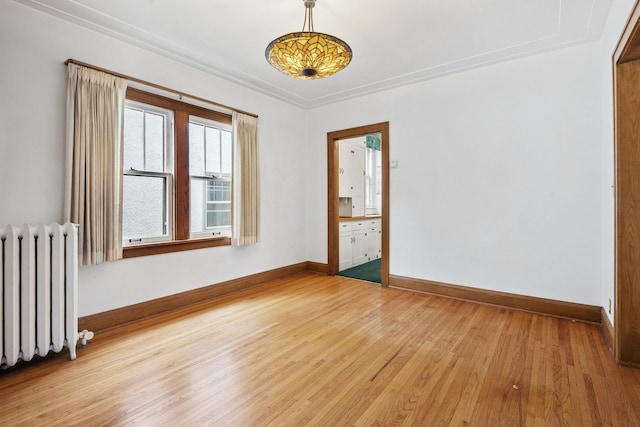 4300 Beard Ave S, Minneapolis, MN 55410 - unfurnished room with radiator heating unit and light wood-style floors