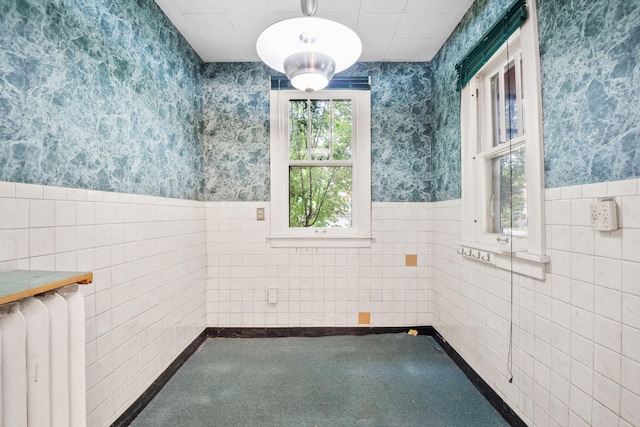 4300 Beard Ave S, Minneapolis, MN 55410 - bathroom featuring tile walls, radiator heating unit, wallpapered walls, and wainscoting