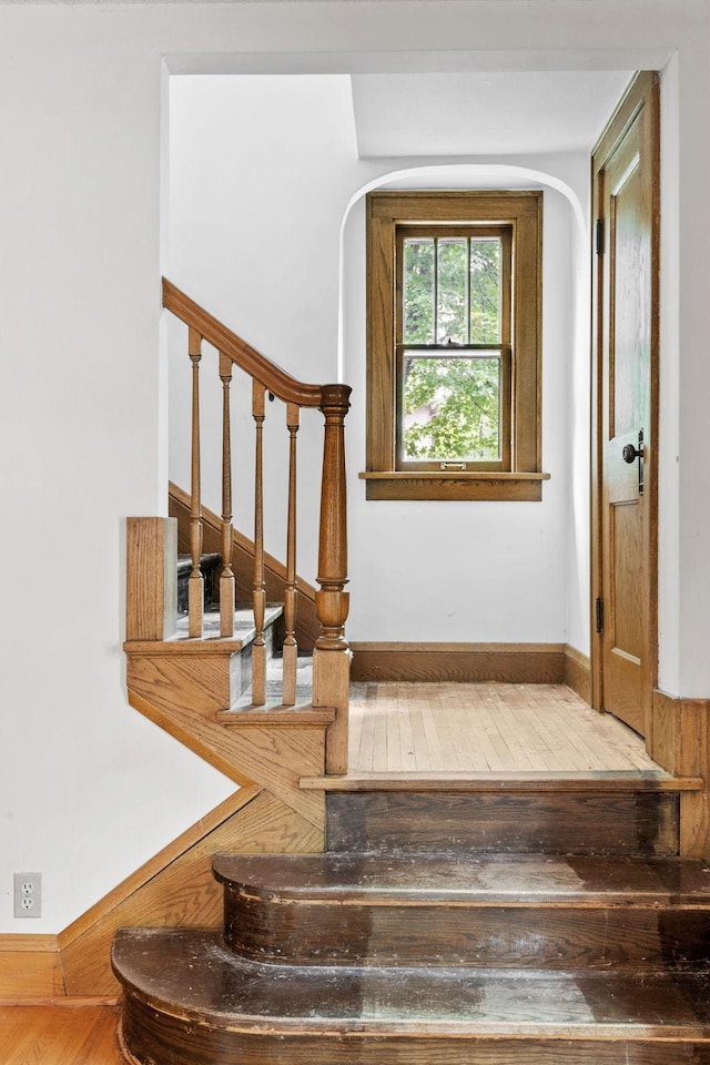 4300 Beard Ave S, Minneapolis, MN 55410 - staircase with hardwood / wood-style flooring and arched walkways
