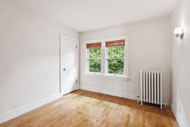4300 Beard Ave S, Minneapolis, MN 55410 - unfurnished room featuring radiator and light wood-style floors