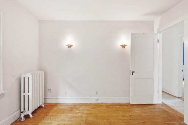 4300 Beard Ave S, Minneapolis, MN 55410 - spare room featuring radiator heating unit and light wood-style flooring