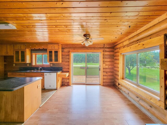 1283 Island Lake Dr NW, Powers Twp, MN 56435 - kitchen with white dishwasher, wood ceiling, log walls, dark countertops, and glass insert cabinets