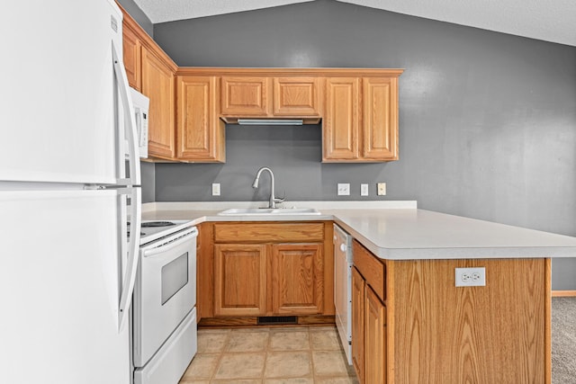 7289 32nd Ave N, Crystal, MN 55427 - kitchen with white appliances, a peninsula, light countertops, and lofted ceiling