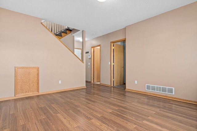 7289 32nd Ave N, Crystal, MN 55427 - unfurnished room featuring wood finished floors and stairs