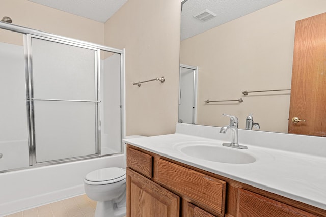 7289 32nd Ave N, Crystal, MN 55427 - full bath featuring vanity, bath / shower combo with glass door, tile patterned floors, and a textured ceiling