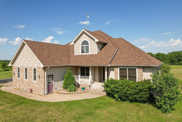 13591 347th St, Chisago Lake Twp, MN 55045 - traditional-style home featuring a porch, a front lawn, a shingled roof, and stone siding
