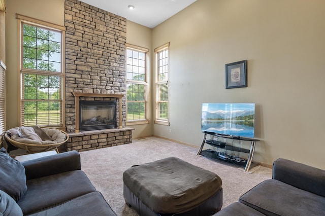 13591 347th St, Chisago Lake Twp, MN 55045 - carpeted living room featuring a stone fireplace and healthy amount of natural light