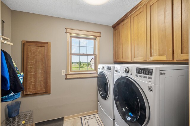 13591 347th St, Chisago Lake Twp, MN 55045 - washroom with separate washer and dryer, cabinet space, a textured ceiling, and tile patterned flooring