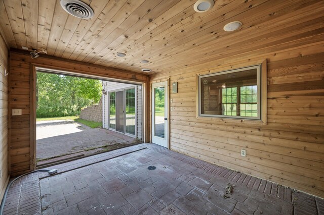 13591 347th St, Chisago Lake Twp, MN 55045 - entryway with wooden walls, brick floors, and wooden ceiling