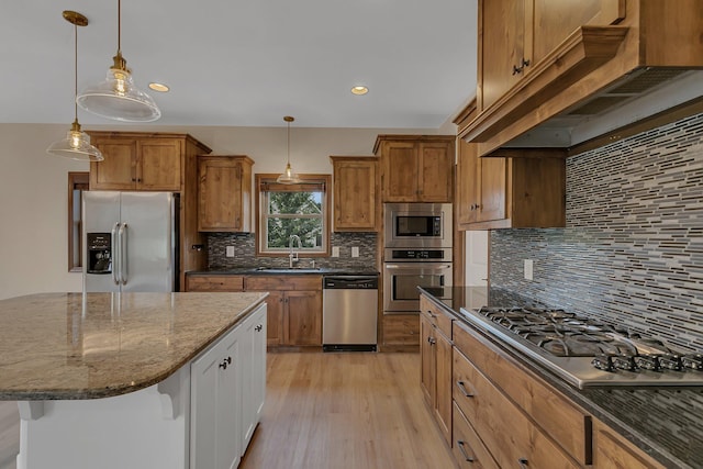 1504 20th Ave S, Sartell, MN 56377 - kitchen with appliances with stainless steel finishes, custom exhaust hood, dark stone counters, brown cabinetry, and decorative backsplash