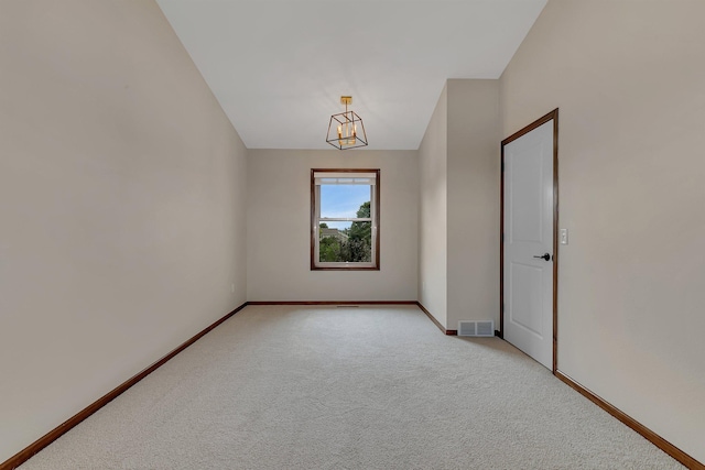 1504 20th Ave S, Sartell, MN 56377 - spare room with light carpet and a chandelier