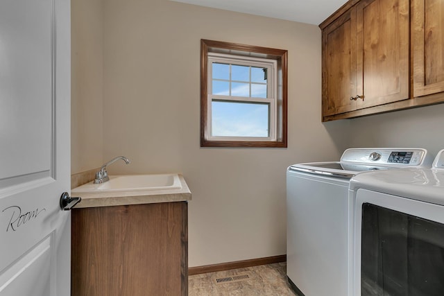1504 20th Ave S, Sartell, MN 56377 - laundry area featuring cabinet space and separate washer and dryer