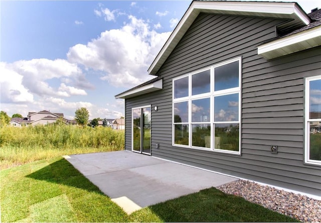 117 Maple Ct, Cannon Falls, MN 55009 - view of property exterior featuring a patio area and a yard