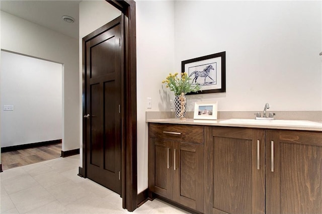 117 Maple Ct, Cannon Falls, MN 55009 - bar with a sink and baseboards