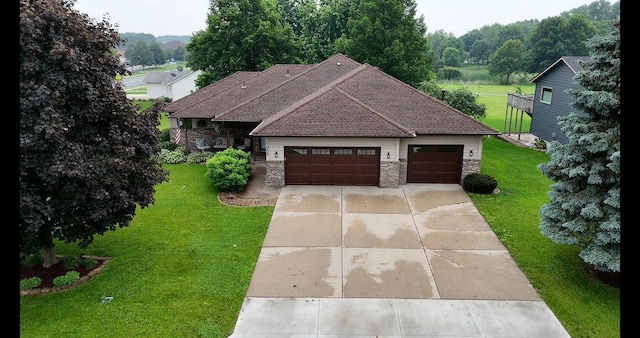 1008 3rd St NE, New Prague, MN 56071 - view of front of house with a front lawn, stone siding, and a shingled roof