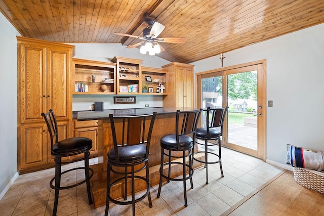 1008 3rd St NE, New Prague, MN 56071 - bar area featuring lofted ceiling, wooden ceiling, a ceiling fan, and light tile patterned floors