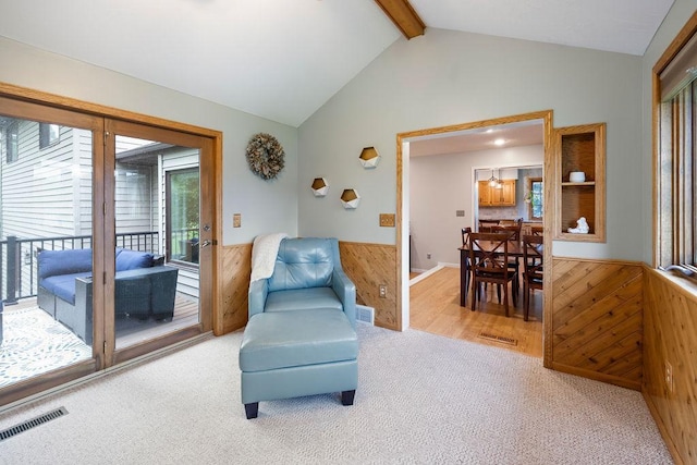 1008 3rd St NE, New Prague, MN 56071 - living area featuring wooden walls, wainscoting, and carpet floors