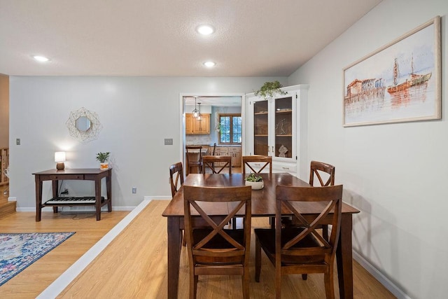 1008 3rd St NE, New Prague, MN 56071 - dining area with light wood finished floors and recessed lighting