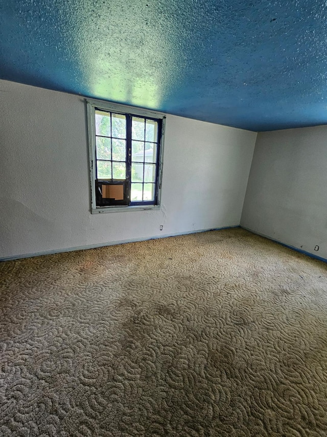 730 Front St, Albert Lea, MN 56007 - carpeted spare room featuring a textured ceiling