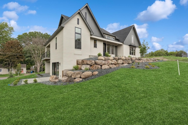 2706 Lakeview Ct, Little Canada, MN 55117 - view of home's exterior featuring a lawn and board and batten siding