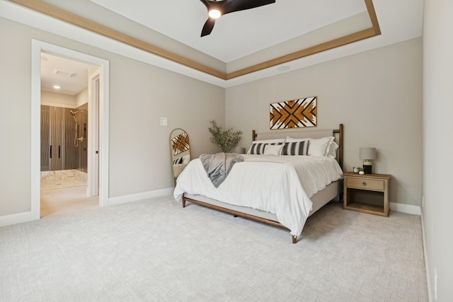 2706 Lakeview Ct, Little Canada, MN 55117 - bedroom with light colored carpet, a tray ceiling, a ceiling fan, and connected bathroom