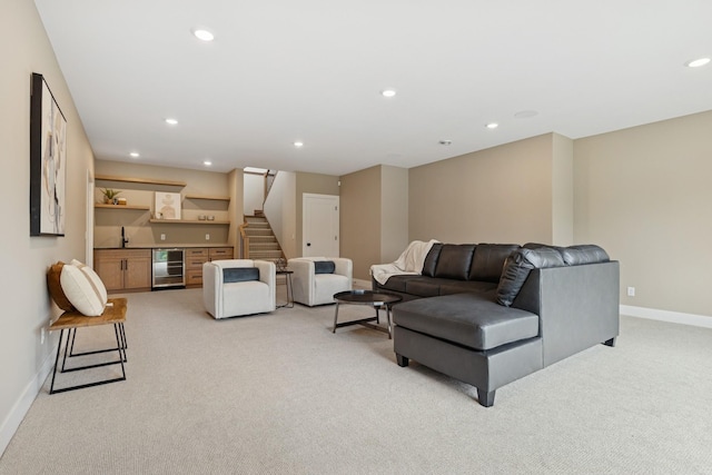2706 Lakeview Ct, Little Canada, MN 55117 - living room with beverage cooler, light carpet, a bar, stairway, and recessed lighting