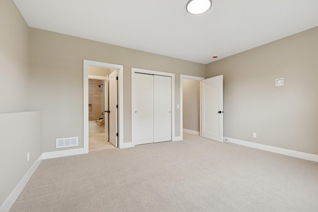 2706 Lakeview Ct, Little Canada, MN 55117 - unfurnished bedroom with light carpet, a closet, and connected bathroom