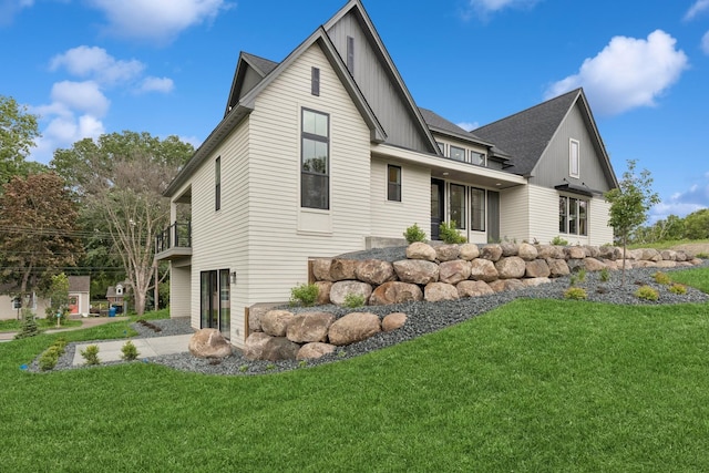 2706 Lakeview Ct, Little Canada, MN 55117 - view of home's exterior featuring board and batten siding and a yard