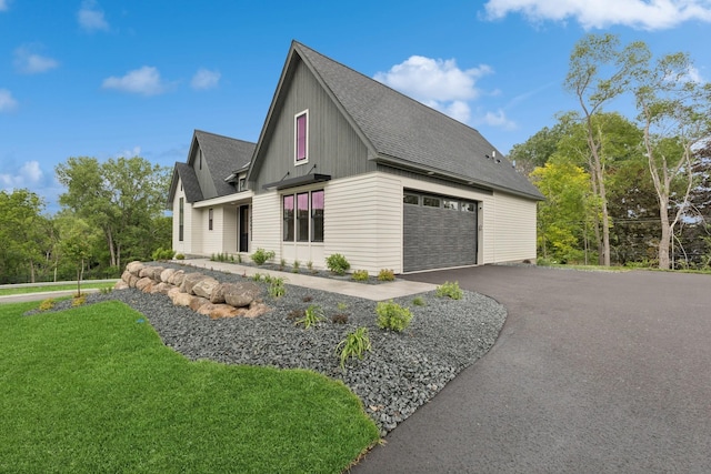 2706 Lakeview Ct, Little Canada, MN 55117 - view of side of property with a shingled roof and driveway