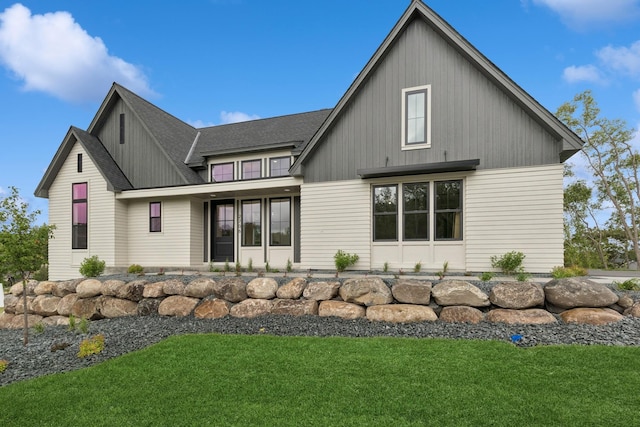 2706 Lakeview Ct, Little Canada, MN 55117 - view of front of house with a front lawn and a shingled roof