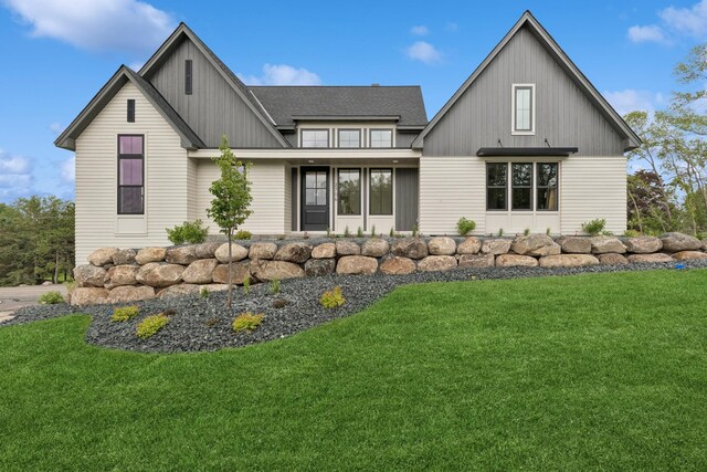 2706 Lakeview Ct, Little Canada, MN 55117 - view of front of home featuring a front yard and board and batten siding