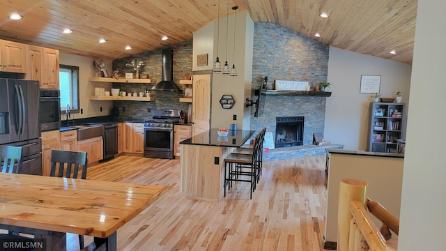 1912 Nelson Lake Rd, Pillager, MN 56473 - kitchen with black appliances, wall chimney exhaust hood, light brown cabinetry, lofted ceiling, and dark countertops