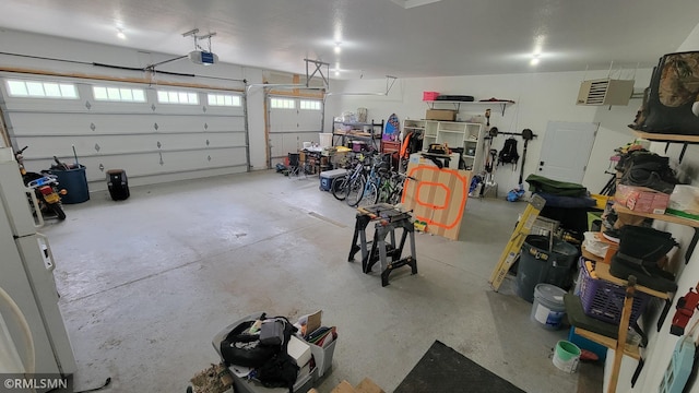 1912 Nelson Lake Rd, Pillager, MN 56473 - garage featuring a garage door opener and a heating unit