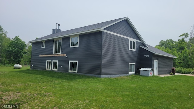 1912 Nelson Lake Rd, Pillager, MN 56473 - rear view of property with a chimney and a lawn
