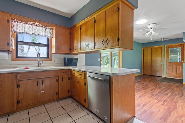 39743 County Road 1, Brockway Twp, MN 56367 - kitchen with stainless steel dishwasher, healthy amount of natural light, ceiling fan, and light countertops