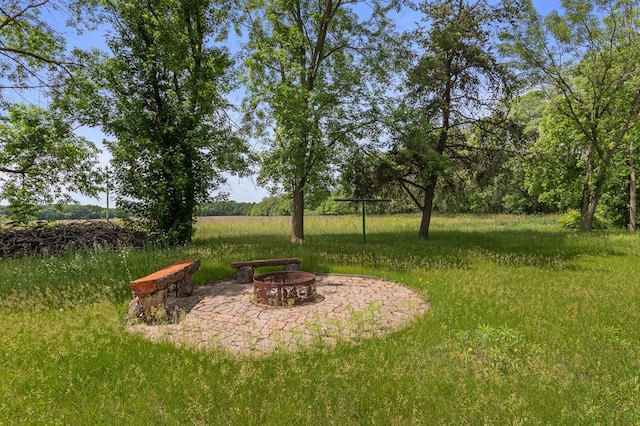 39743 County Road 1, Brockway Twp, MN 56367 - view of yard featuring a fire pit and a patio