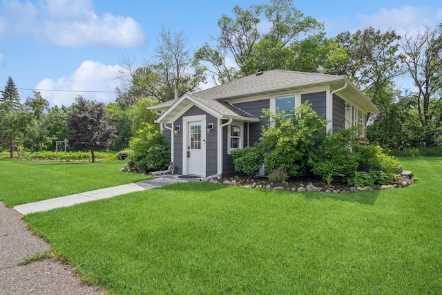 3178 253rd Ave NW, Isanti, MN 55040 - view of front of house featuring a front yard and a shingled roof