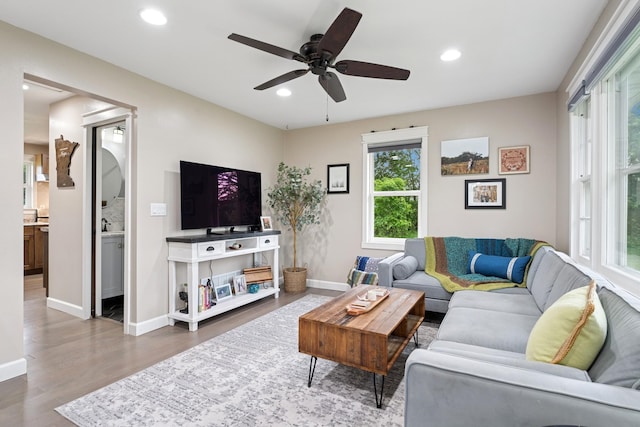 3178 253rd Ave NW, Isanti, MN 55040 - living area featuring wood finished floors, recessed lighting, and a ceiling fan