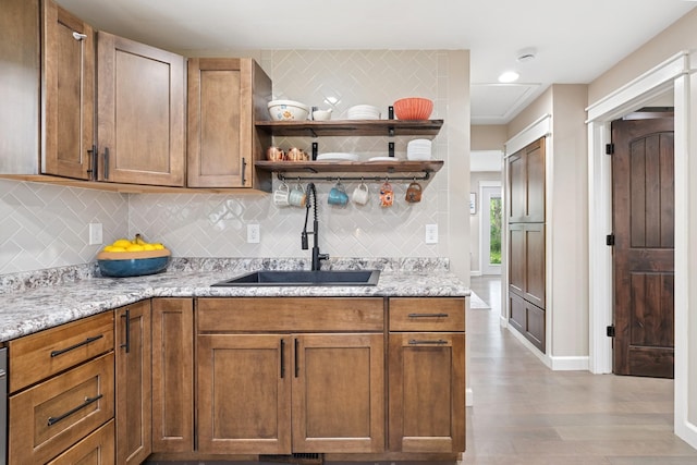 3178 253rd Ave NW, Isanti, MN 55040 - kitchen featuring wood finished floors, decorative backsplash, open shelves, light stone countertops, and recessed lighting