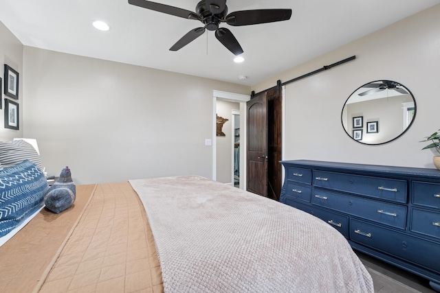 3178 253rd Ave NW, Isanti, MN 55040 - bedroom featuring a barn door, recessed lighting, and ceiling fan