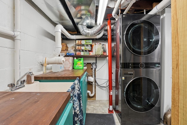 3178 253rd Ave NW, Isanti, MN 55040 - washroom with stacked washing machine and dryer and concrete block wall