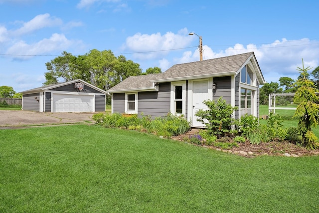 3178 253rd Ave NW, Isanti, MN 55040 - view of front of property with an outdoor structure, a detached garage, and a front yard
