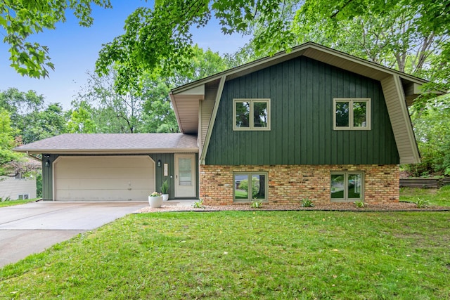 6980 Crest Dr, Maple Grove, MN 55311 - split level home featuring a garage, a front yard, concrete driveway, brick siding, and board and batten siding