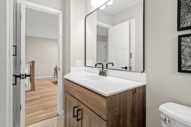 6980 Crest Dr, Maple Grove, MN 55311 - bathroom featuring vanity and wood finished floors