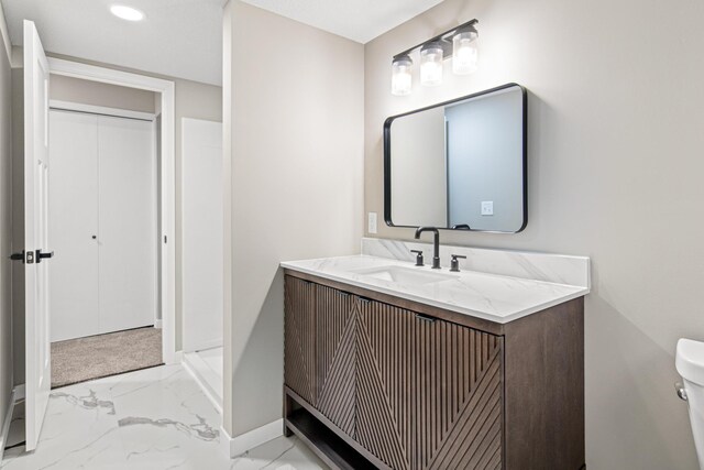 6980 Crest Dr, Maple Grove, MN 55311 - bathroom featuring vanity, marble look tile flooring, and recessed lighting