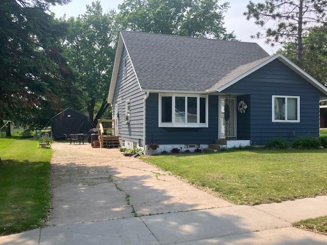 707 Marshall Ave, Henning, MN 56551 - view of front facade with a shingled roof and a front yard