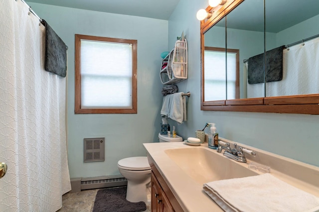 707 Marshall Ave, Henning, MN 56551 - full bath with a baseboard heating unit, vanity, heating unit, and curtained shower