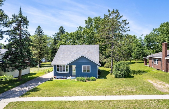 707 Marshall Ave, Henning, MN 56551 - view of front of property featuring a front yard and a shingled roof